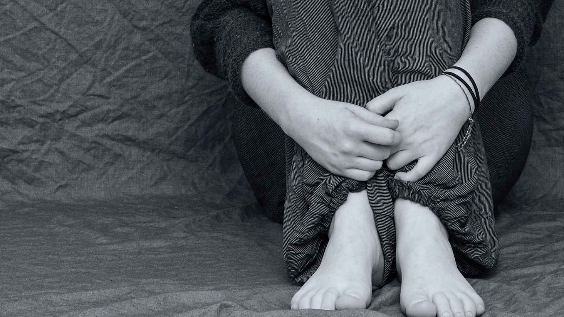 Essstörungen bei Klienten im Coaching erkennen, Frau sitzend